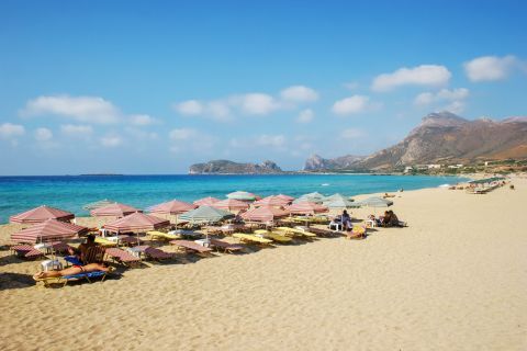 Umbrellas and sun loungers on Falasarna beach, Chania.