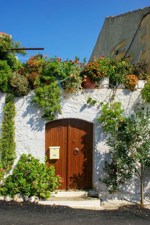 A lovely house in Rodopos village, decorated with beautiful flowers.