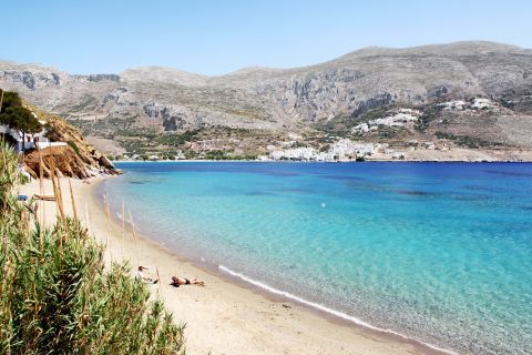 Azure waters, soft sand and view of the surrounding mountainsides. Fokiotrypa beach, Amorgos.