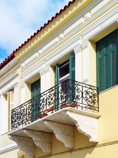The balcony of an elegant, Neoclassical building. Chora, Andros.