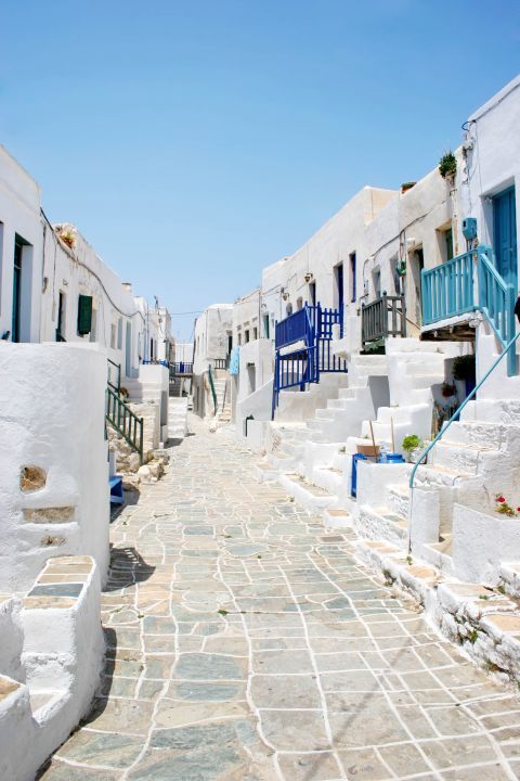 Whitewashed houses with blue colored details