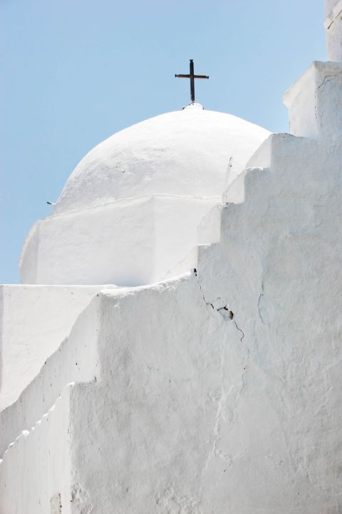 Old, Cycladic church in white colour