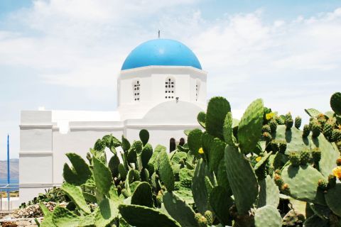 The white church of Panagia with the blue dome