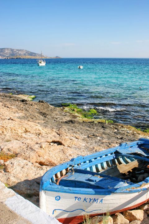 A partly ruined fishing boat, left on the sandy beach of Chora, Koufonisia.