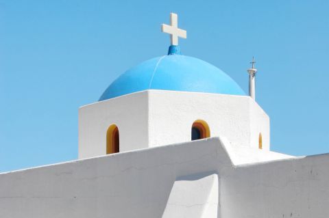 Whitewashed church with a blue dome.