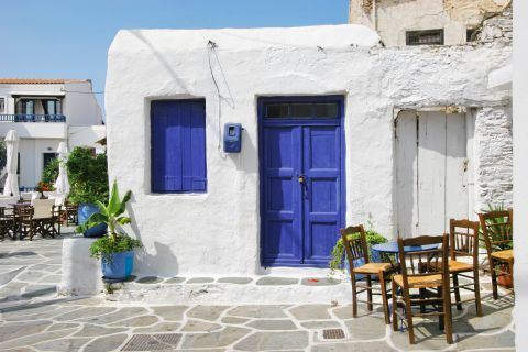 Blue doors and shutters on whitewashed houses. Typical, Cycladic style.