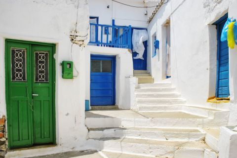 Whitewashed houses with colorful details in Driopida.