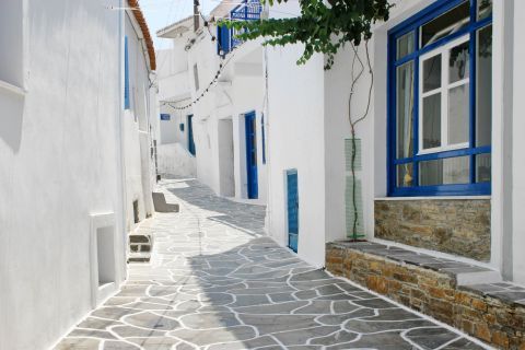 A paved alley, painted in white and blue colors.