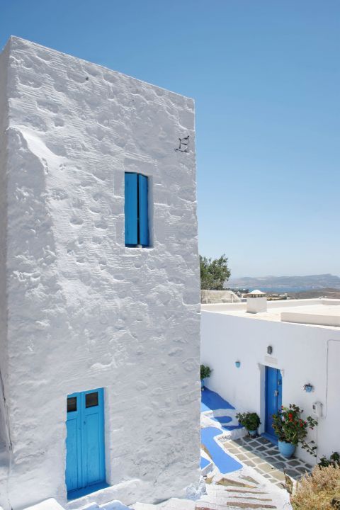 Well-preserved houses in white and blue colors. Plaka village, Milos.