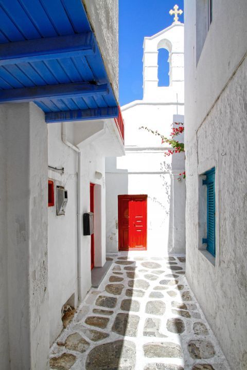 Paved alley with traditional Cycladic buildings