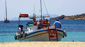 Water taxi at Ornos Beach