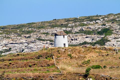A whitewashed windmill in Lefkes village.