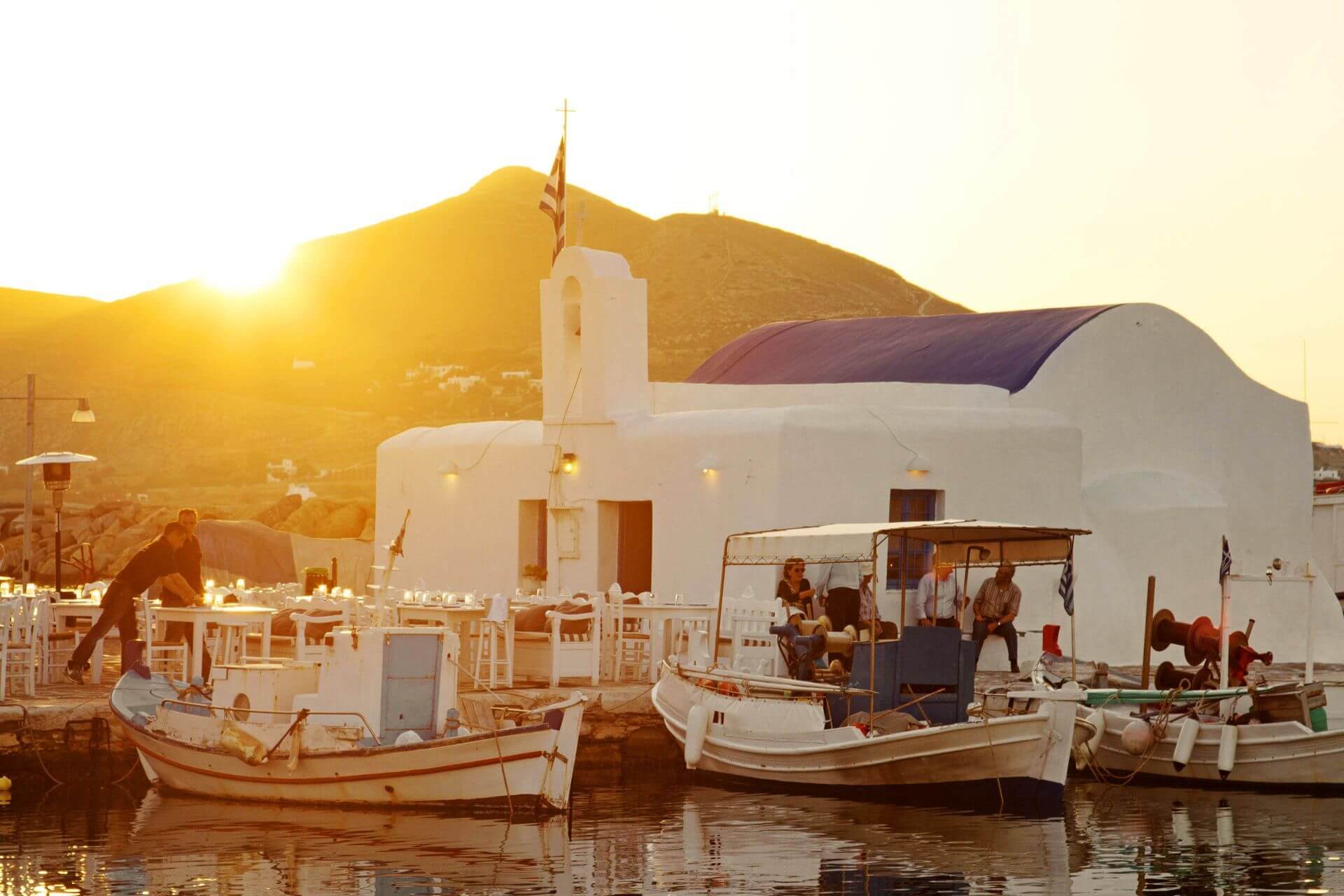 Sunset from the little harbour of Naoussa, the cosmopolitan village of Paros