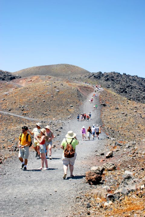 The volcanic land of Santorini is popular to many tourists