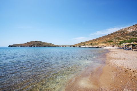 Crystal clear waters and soft sand. Delfini beach, Syros.
