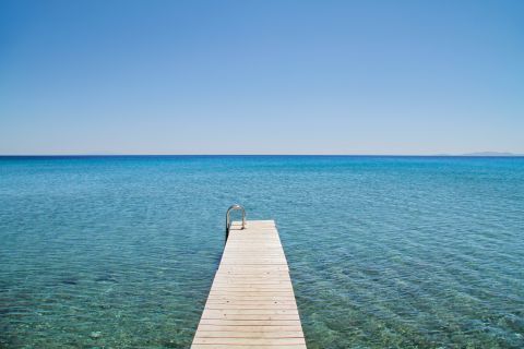 Swim in the crystal clear waters of Platia Ammos, Tinos.