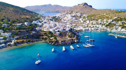 Deep blue waters, hills and whitewashed houses on Patmos, Agia Marina village