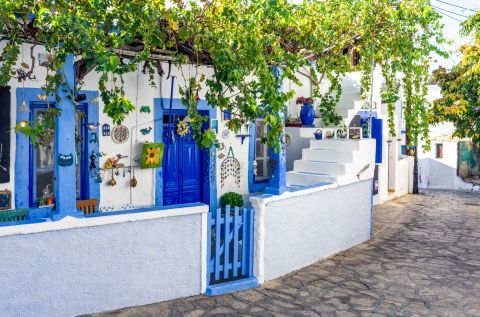 Whitewashed house with blue colored details on Lipsi