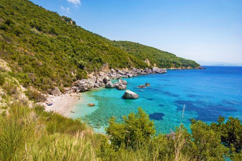 The secluded Agios Sostis beach. An unspoiled place with dense vegetation and clear waters.