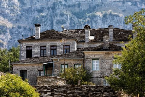 Stone built houses with chimneys and rood tiles, Papigo village