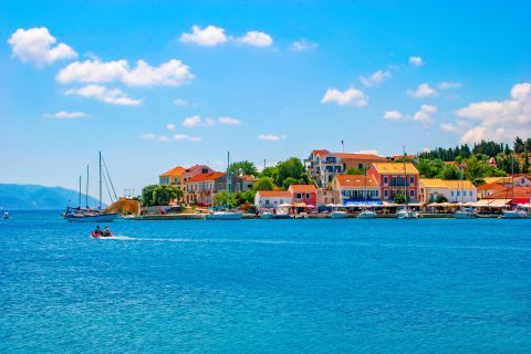 Colorful houses, overlooking the blue waters of Fiscardo, Kefalonia.