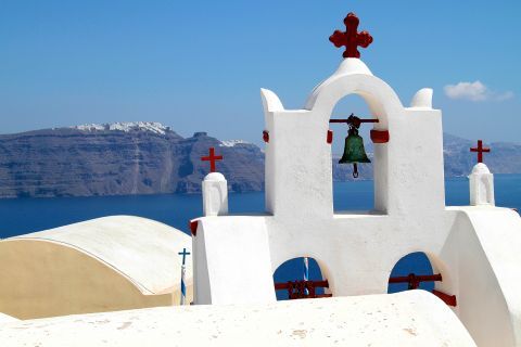 The belfry of a whitewashed chapel in Oia, Santorini.