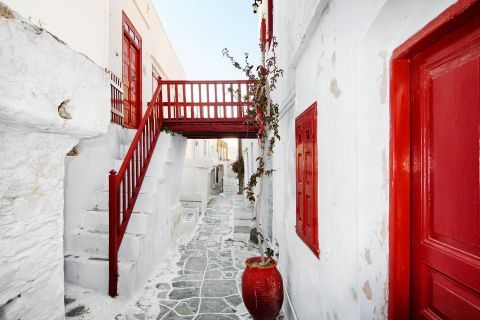 Whitewashed houses with red-colored details.