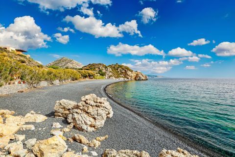 Dark pebbles in Mavra Volia beach, Chios.