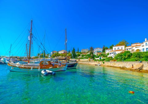 Boats in the azure waters of Spetses