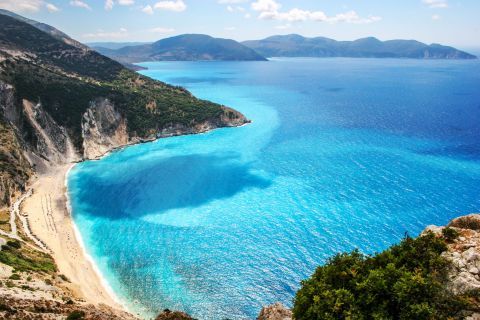 Myrtos beach is located in a beautiful area with huge verdant hills