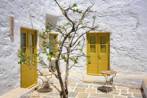 Whitewashed building with colored details, Milos