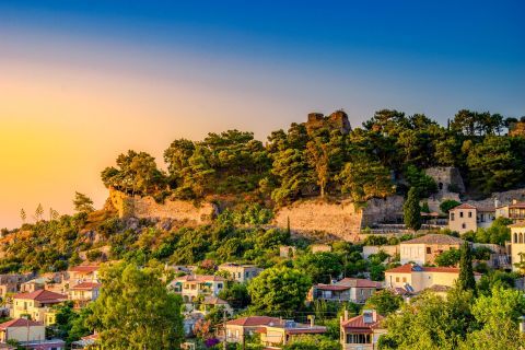 Lush vegetation, traditional houses and the Medieval Castle of Kyparissia