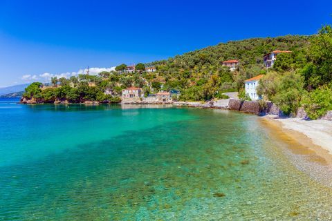 Turquoise waters and impressive natural surroundings on the beach of Milina village, Pelion.