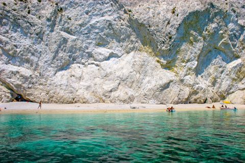 Marathonisi Islet: White stones and turquoise waters.