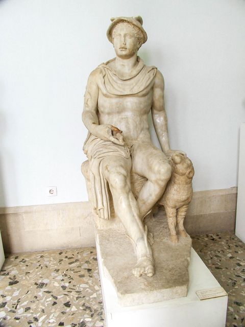 Archaeological Museum: Marble statue of Hermes, siting on a rock.