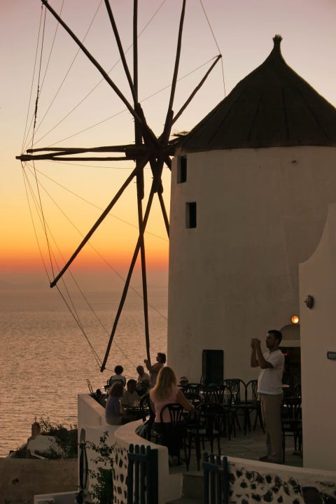 Sunset: A windmill and the sunset of Santorini