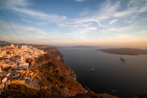 Sunset: Panoramic view of Santorini and its Cycladic buildings during sunset