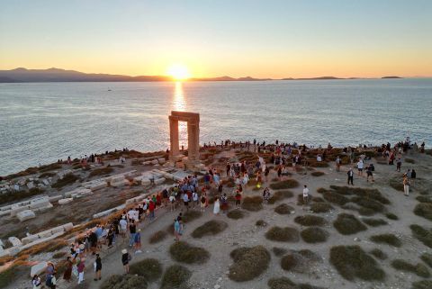 Portara (or Temple Of Apollo): People gathering for the sunset at the Portara