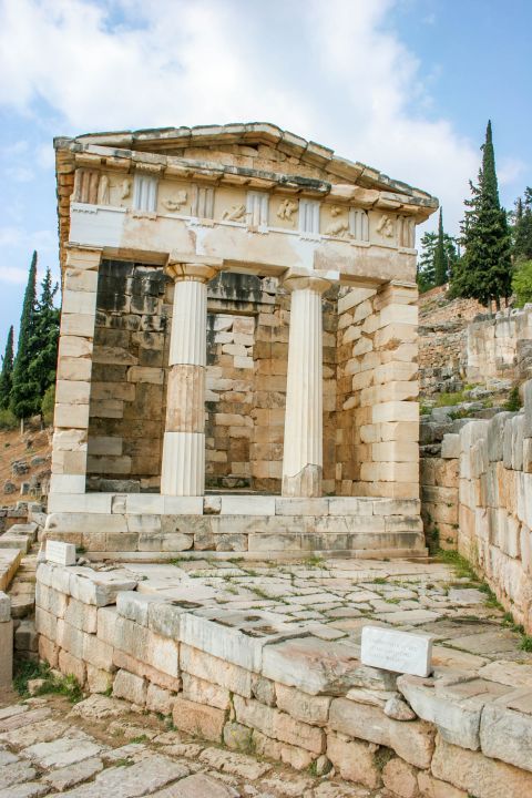 Athenians Treasury: The architectural style of the temple is Doric and the main construction material is the Parian marble.