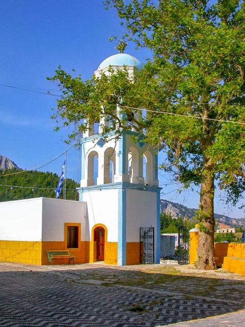 Asomatos: Tall belfry of a local church.