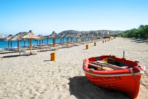 Kalafatis: A small, red boat on Kalafatis beach