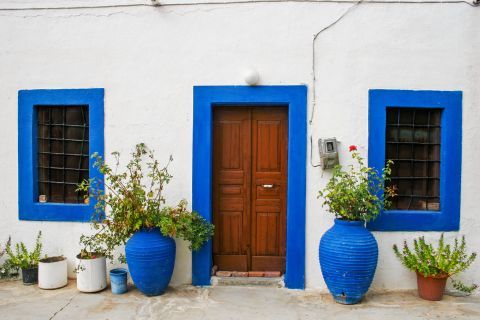 Lagoudi: A picturesque house in white and blue colors.