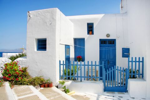 Town: Whitewashed house with blue-colored details