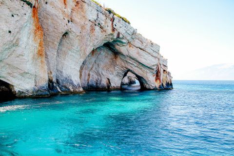 Navagio or Shipwreck: Rock formations and blue waters.