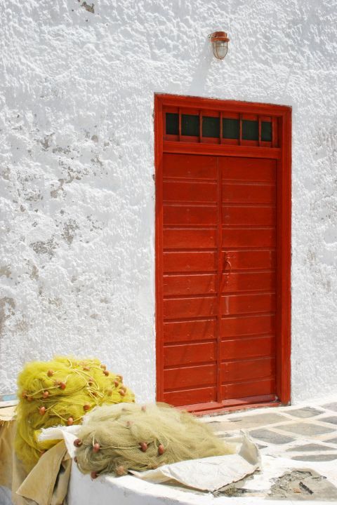Agia Irini: A red door and fishing nets