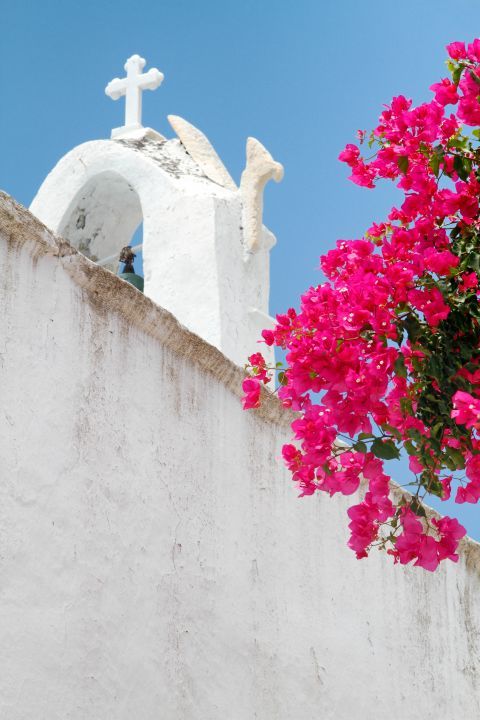 Parikia: The top of a church and colorful flowers