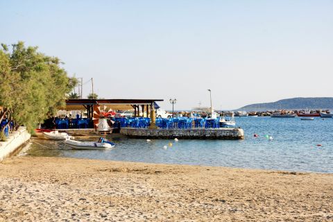 Aliki: Outdoor seating of a taverl, situated right by the sea