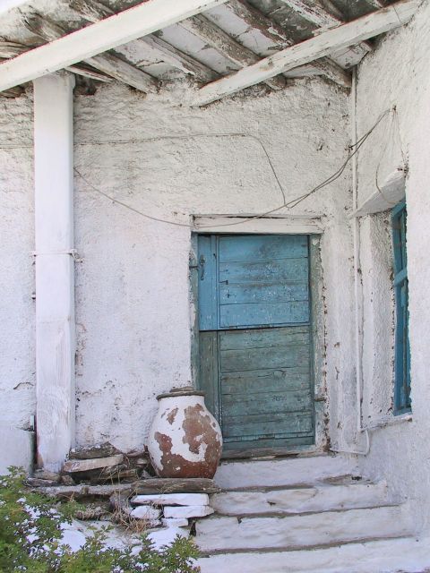 Dyo Choria: Whitewashed house with a blue door