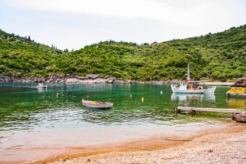 Filiatro: Fishing boats on the turquoise waters of Filiatro beach.