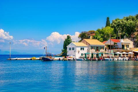 Logos: Venetian houses, overlooking the amazing blue waters of the Ionian sea